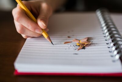 Using a Pencil to Write on Paper by Thought Catalog