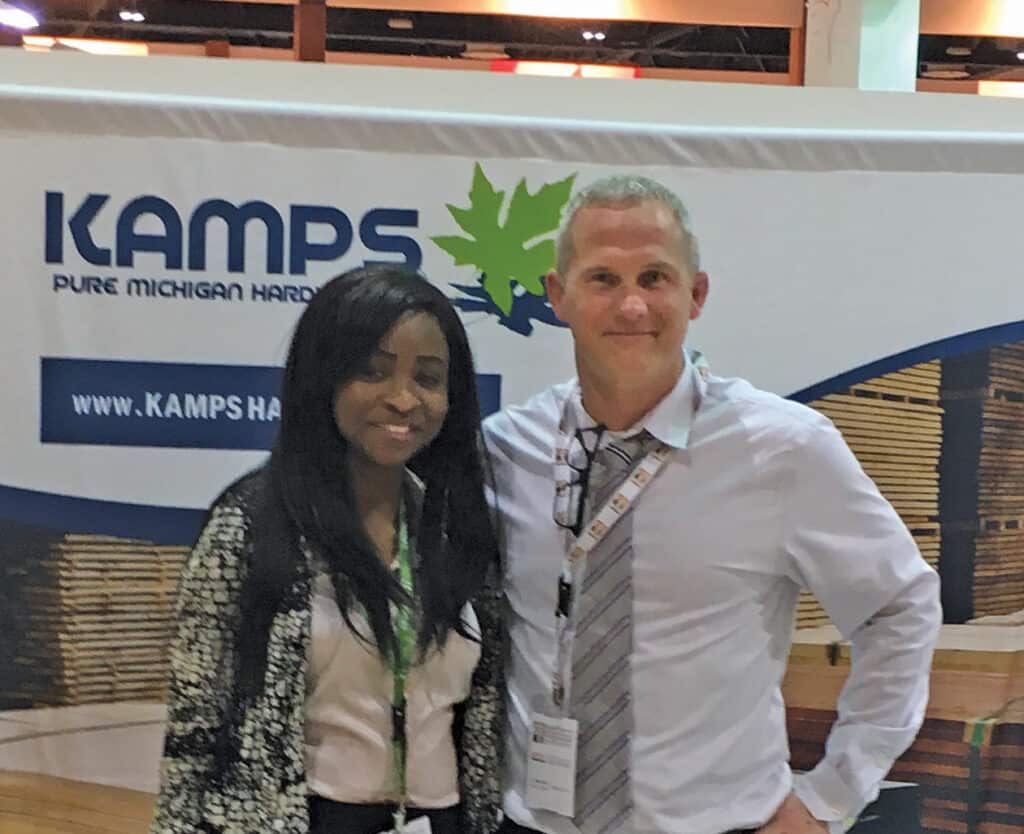 Rob Kukowski is seen at the Kamps Hardwoods' booth at the 2019 Mumbaiwood trade show in Mumbai, India, with Wuraola Ogundimu. She works with a trade promotion company that coordinates with organizations supporting commerce and economic development in Michigan and various other Hardwood producing states.