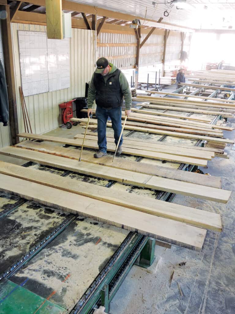 At Eagle Lumber, Jay Scantland inspects 8/4 White Oak.