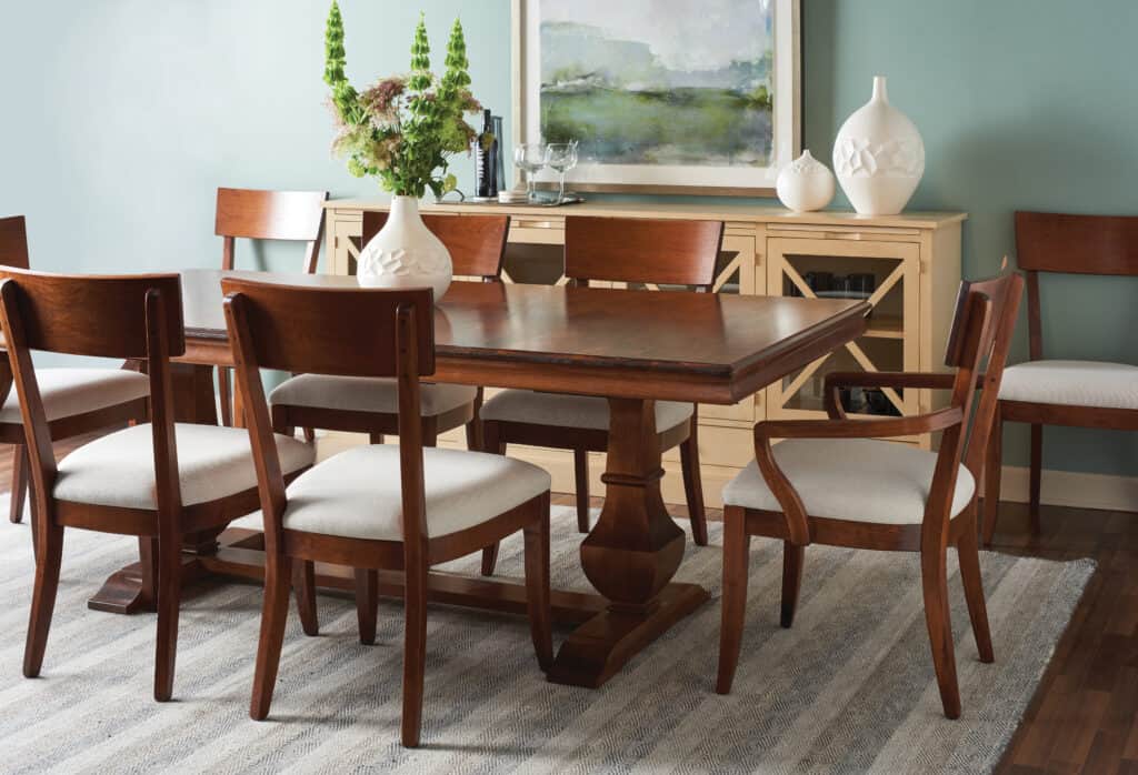 Gat Creek’s Palisade dining room table and Bella chairs, both made of Cherry, add elegance to a home.