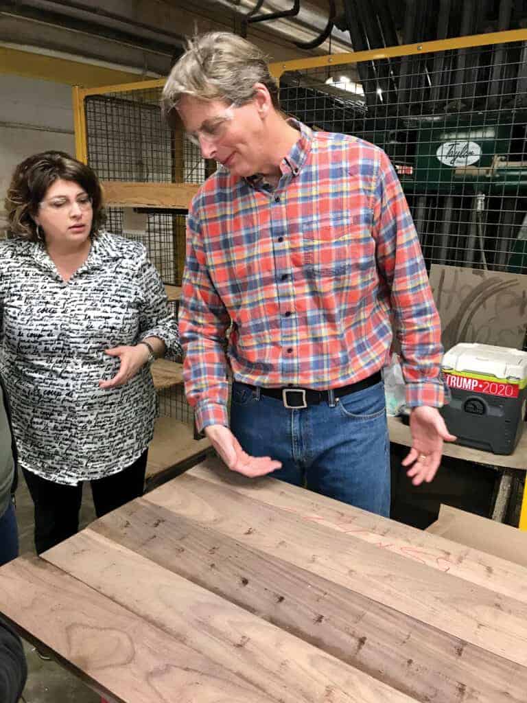 CEO Gat Caperton describes the qualities of this wood panel during a factory tour.