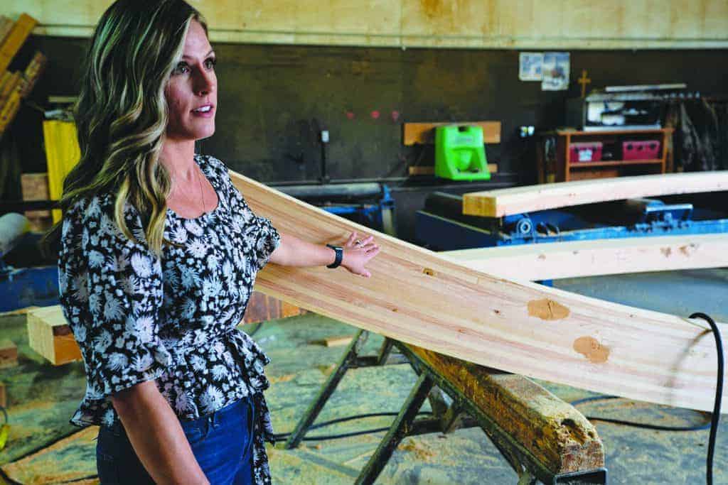 At Calvert Co. Inc.’s Vancouver Mill, Brittany Coltrane, Sales Manager, explains the finishing process for the curved beam shown.