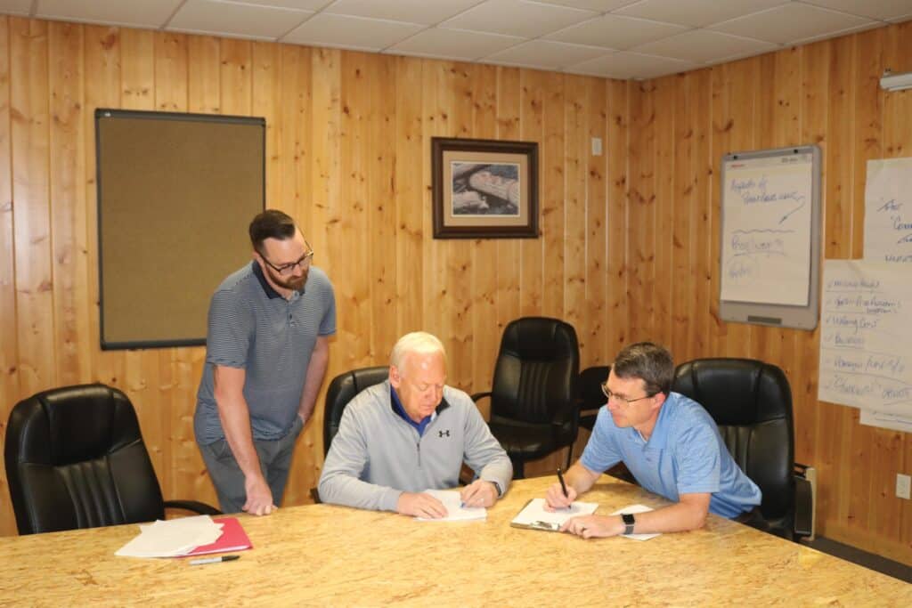 (L to R) Matt Beikman plywood buyer, Bob Bush lumber buyer and General Manager Mark Drone review purchasing needs.