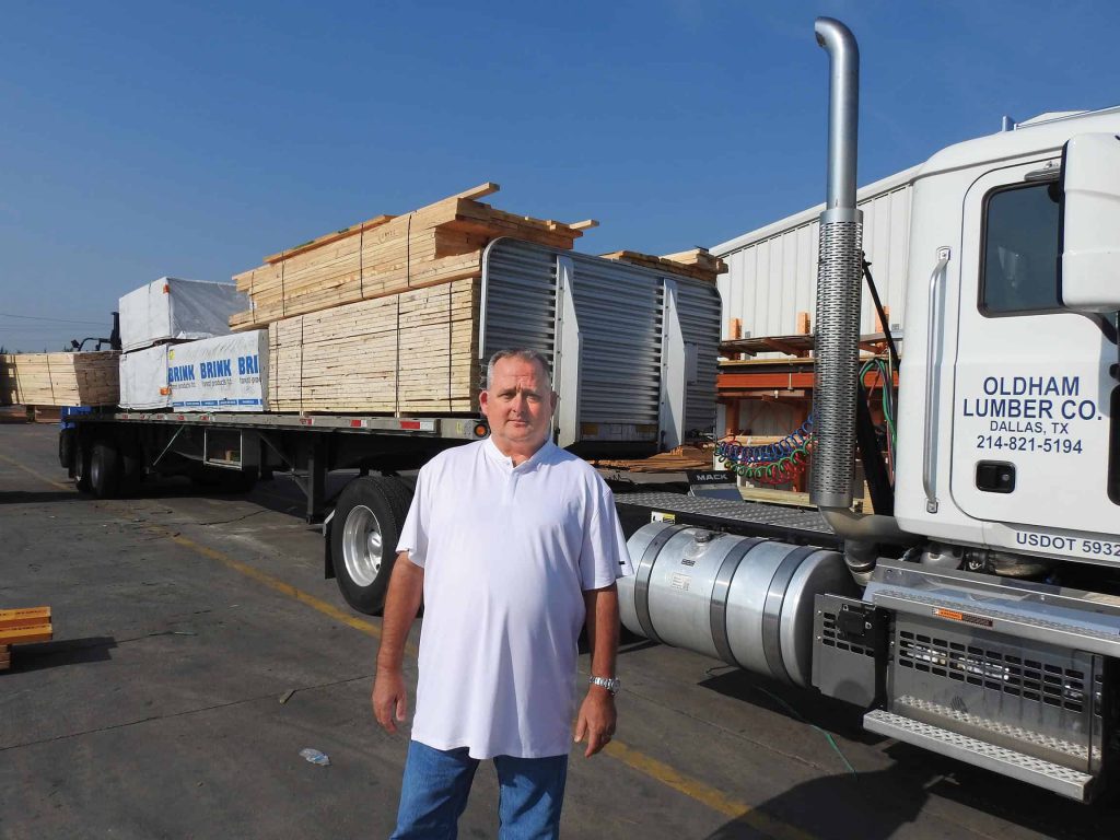Oldham Lumber Co-owner Harley “Bubba” Finnell Jr. gives the green light to another load heading to the company’s custom home builders.