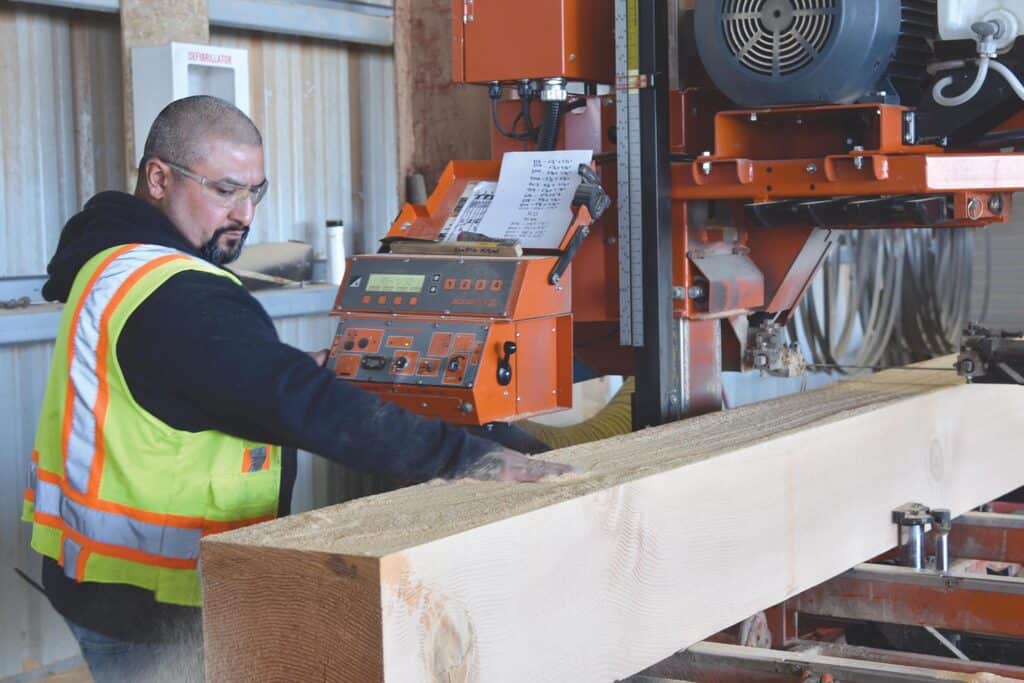 Elk Creek Forest Products: 20 Years Of Sustained Growth 4 A timber is being processed at resaw at Elk Creek Forest Products.