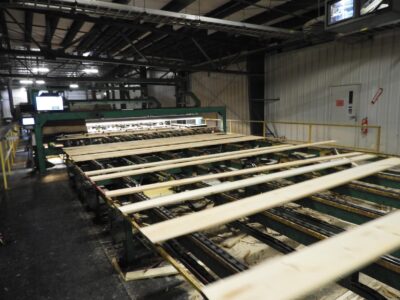 Softwood Forest Products Buyer 7 Boards go down the sawmill auto grading line.