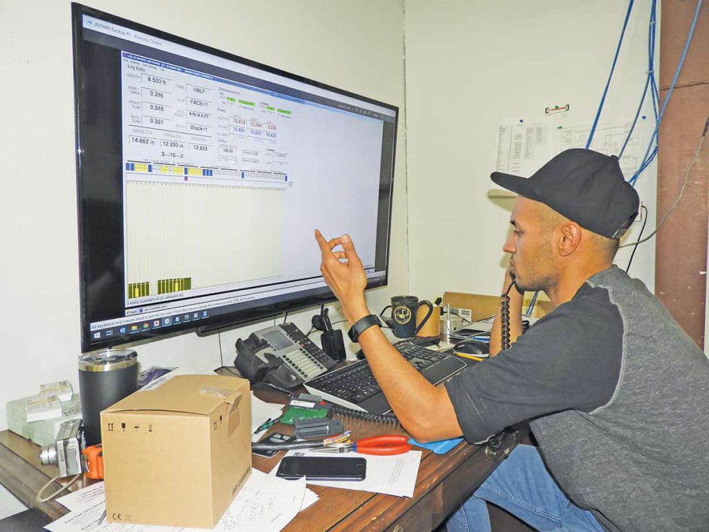 Othman Ali, chief engineer, works on a scanning program.