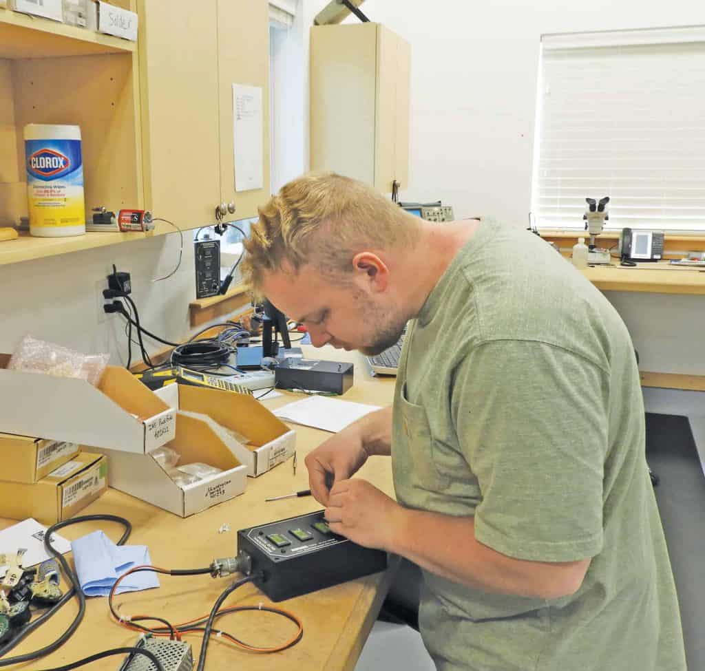 Ed Grambusch, manufacturing assembler, tests PVT.