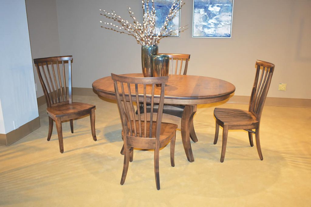 Maple with a medium stain on this dining set from Country View Furniture, of Millersburg, OH was on display at High Point.