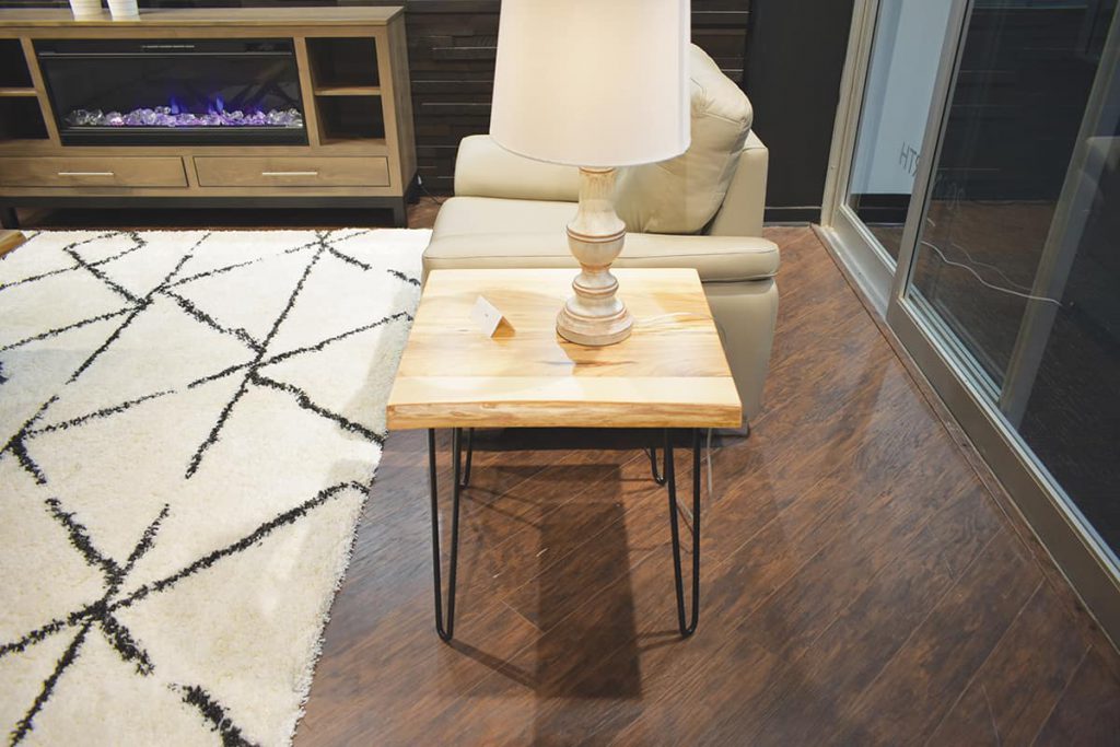 A live edge Maple side table that incorporated metal legs was admired at the Market.