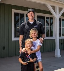 U.S. Navy Petty Officer 2nd Class (Ret.) Daniel “Doc” Jacobs, and his children