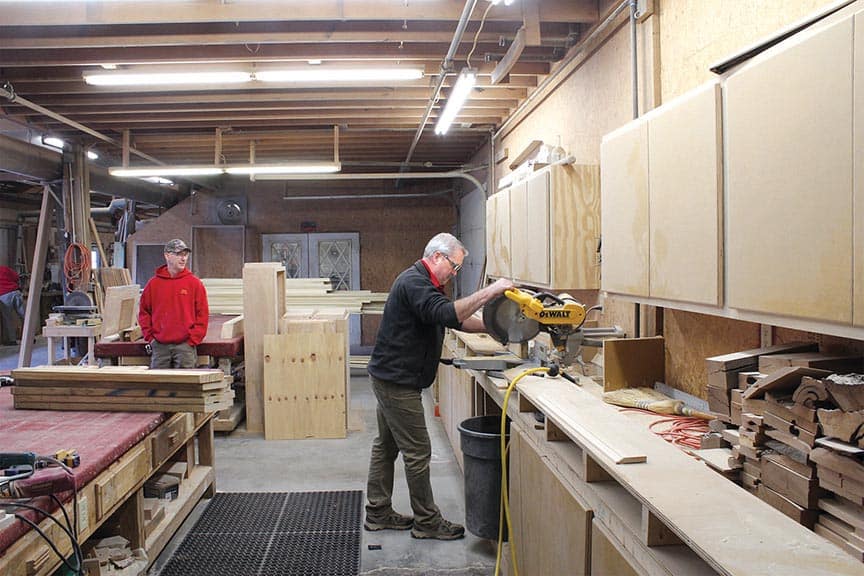 Hardwood trim is shown being processed through an SCMI NT Moulder at Long’s Hardwoods.